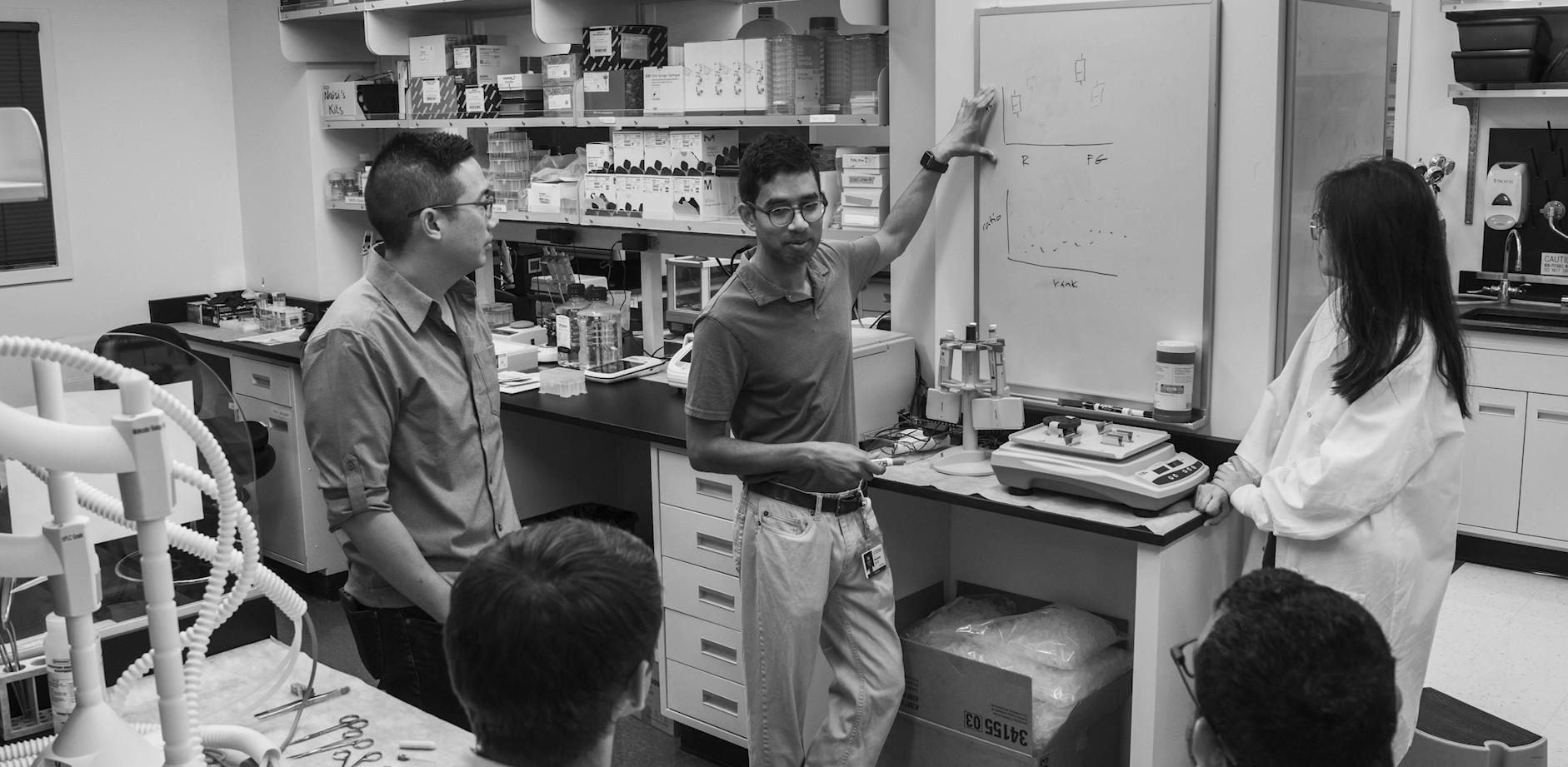 Dr. teaching at a whiteboard
